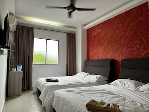 Habitación cuádruple Deluxe | Wifi gratis y ropa de cama