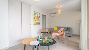 Comfort Apartment | Living area | 108-cm flat-screen TV with digital channels, TV