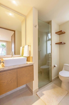 Shower, hair dryer, towels, shampoo