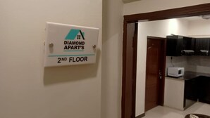 A sign indicating 'Diamond Apart's 2nd floor' in a hallway. - Remarkable Diamond Apartment Dha Defense Karachi (Karachi)
