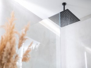 A modern shower with a square, perforated ceiling. - House of Nice Memories (Orebic)