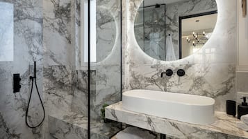 Deluxe Suite, Sea View | Bathroom | Shower, rainfall showerhead, designer toiletries, hair dryer