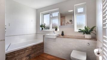 Bathtub, hair dryer, towels