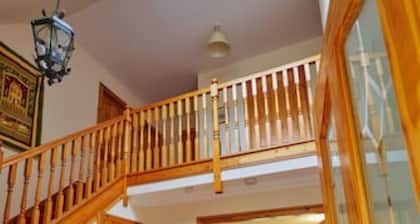 Country farmhouse sleeps 9 with enclosed garden and games barn.