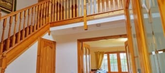 Country farmhouse sleeps 9 with enclosed garden and games barn.