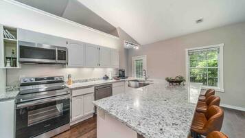 Coffee/tea maker, fridge, microwave, oven