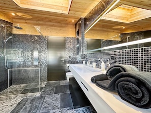 Bathtub, hair dryer, towels