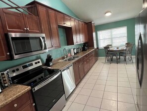 Fridge, microwave, oven, stovetop - Hidden Gem- stylish 3BR house w/heated pool (Palm Coast)