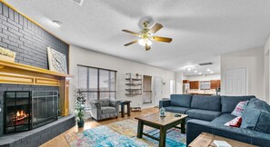 Smart TV, fireplace, books, stereo