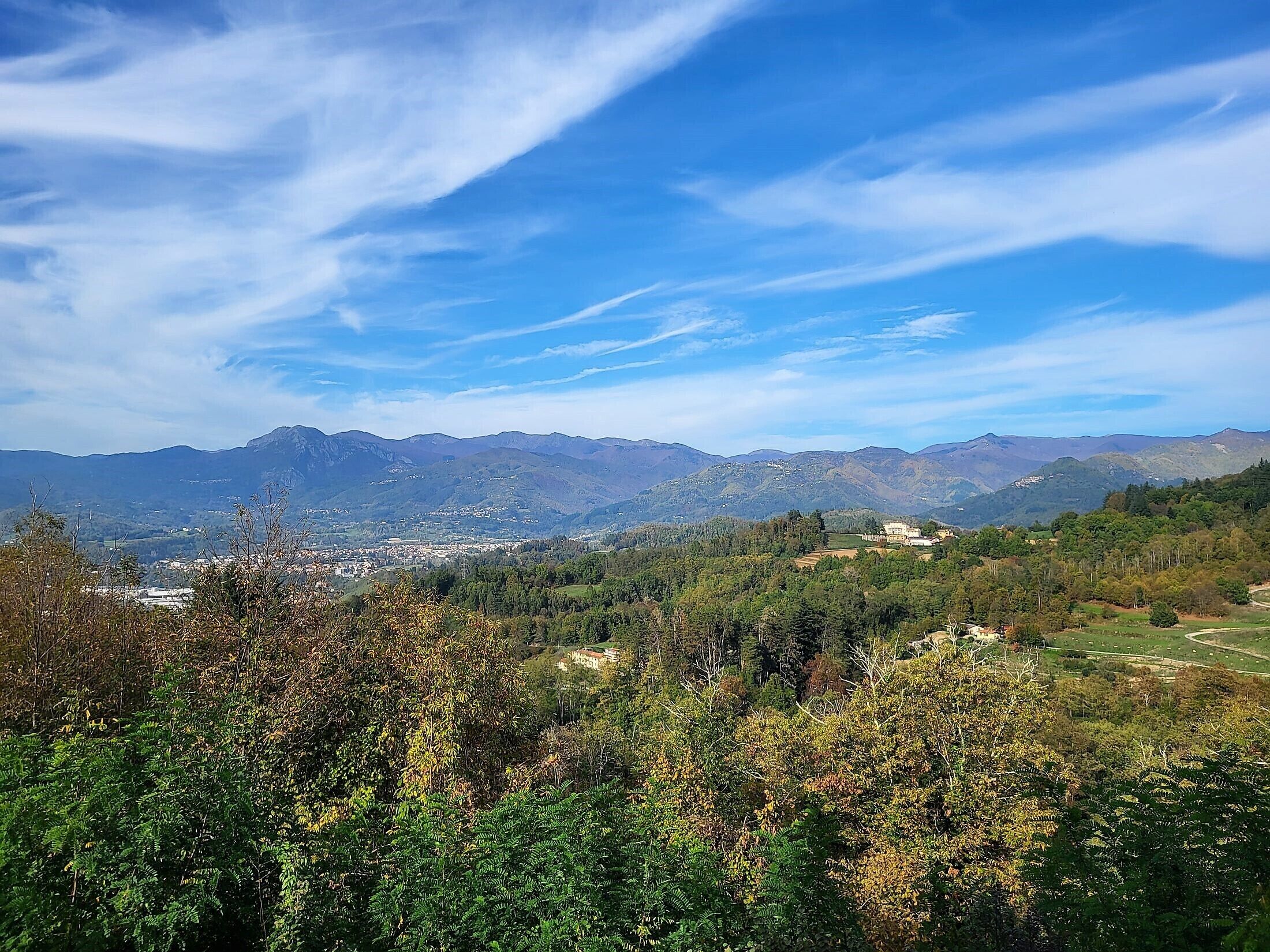 A mountainous landscape with a town in the valley.