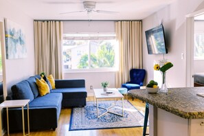 Deluxe 1-Bedroom King w/ Kitchen & Sofa Bed | Living area | 42-inch Smart TV with digital channels, TV, Netflix - Galleria Apartments by Lowkl (Fort Lauderdale)