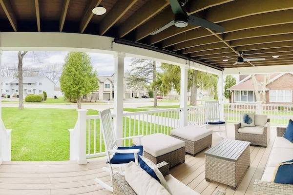 The wraparound porch has ample seating for enjoying the outdoors and equipped with screens for added privacy.
The Bay across the street displays beautiful sunsets you can appreciate from the comfort of the outdoor furniture.