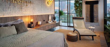 A modern bedroom with a large bed, a lounge chair, a city view, and a decorative wall piece.