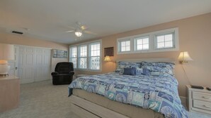 A bedroom with a bed, a chair, a desk, and a window. - Easy beach access!  3 bedroom, 2.5 Bath, a must see! (Ocean City)