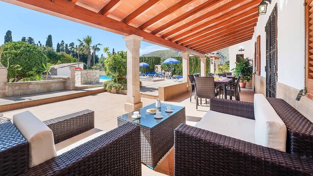 An outdoor patio with wicker furniture, a pool, and a covered area with a wooden ceiling. - Palmestar, Finca 5StarsHome Mallorca (Puerto Pollensa)