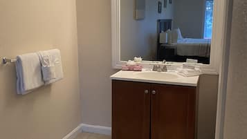 Combined shower/tub, hair dryer, towels, soap