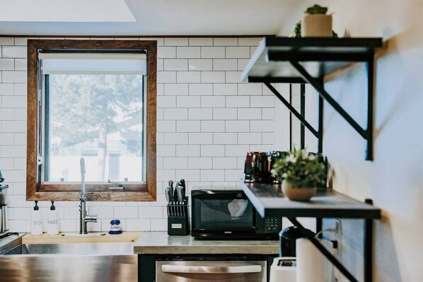 Fridge, coffee/tea maker, cookware/dishes/utensils