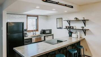 Fridge, coffee/tea maker, cookware/dishes/utensils