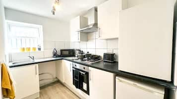 Apartment | Private kitchen | Full-sized fridge, microwave, electric kettle, toaster