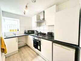 Apartment | Private kitchen | Full-size fridge, microwave, electric kettle, toaster