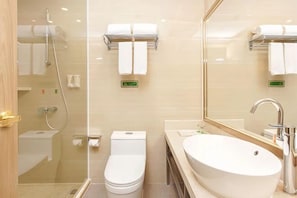 A modern bathroom with a glass-enclosed shower, a white toilet, and a large sink with a mirror above it. - Vienna 3 Best Hotel (Chongqing)