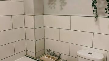 Combined shower/tub, hair dryer, towels, soap