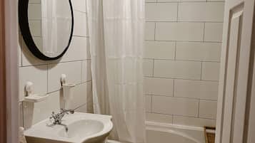 Combined shower/tub, hair dryer, towels, soap