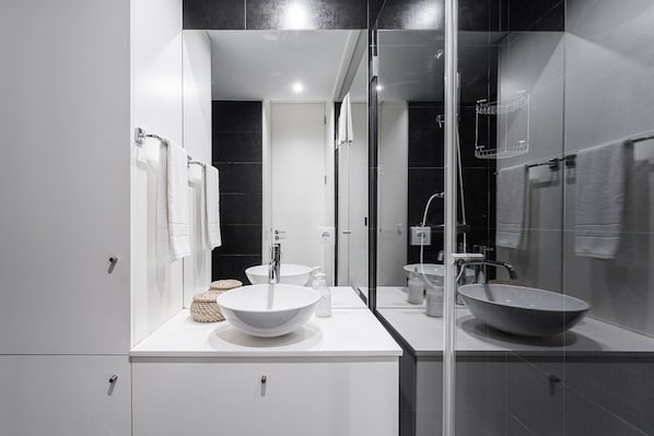 Shower, hair dryer, towels, soap