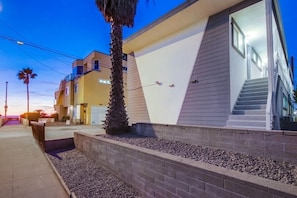 Stylish residential building with a unique design, featuring a combination of horizontal and vertical lines.
