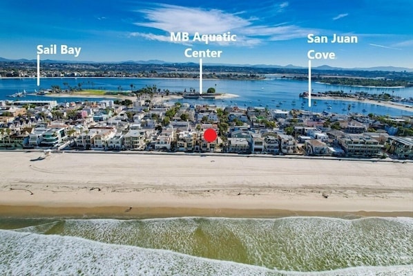 A coastal town with a beach, MB Aquatic Center, and San Juan Cove.