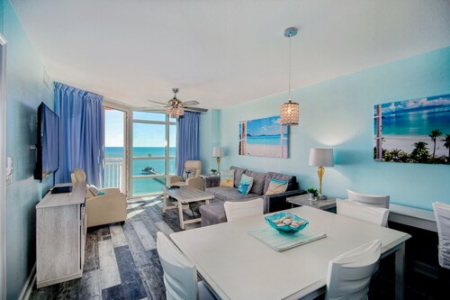 Ocean View condo with a balcony, heated pool, hot tub, W/D, gym, & beach access