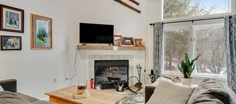 Slopeside condo with nearby skiing, balcony, fireplace, & washer/dryer