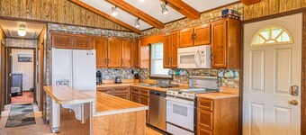 Dog-friendly lakefront home with dock, kayaks, washer/dryer, & central AC