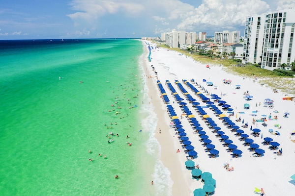 Beautiful Gulf Coast with beach chair and umbrella rentals