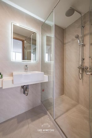 Superior Studio | Bathroom | Rainfall showerhead, designer toiletries, hair dryer, bathrobes