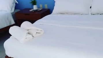 Ropa de cama hipoalergénica y espacio para trabajar con laptop