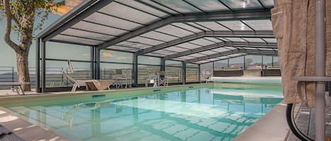 Indoor pool, outdoor pool, open 9:00 AM to 7:00 PM, pool umbrellas