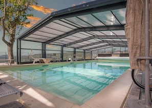 Indoor pool, outdoor pool, open 9:00 AM to 7:00 PM, pool umbrellas