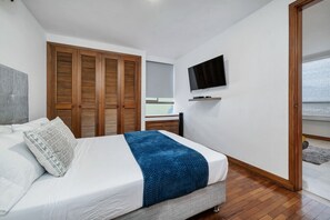 1 bedroom, desk, iron/ironing board, travel crib