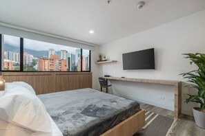 1 bedroom, desk, iron/ironing board, travel crib