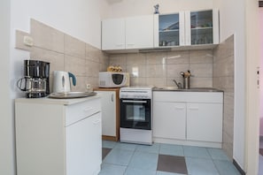 Family Apartment (A1) | Private kitchen | Fridge, microwave, oven, stovetop