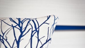 A pillow with a blue abstract design on a white background. - Ryans Pocket (Ibiza Town)