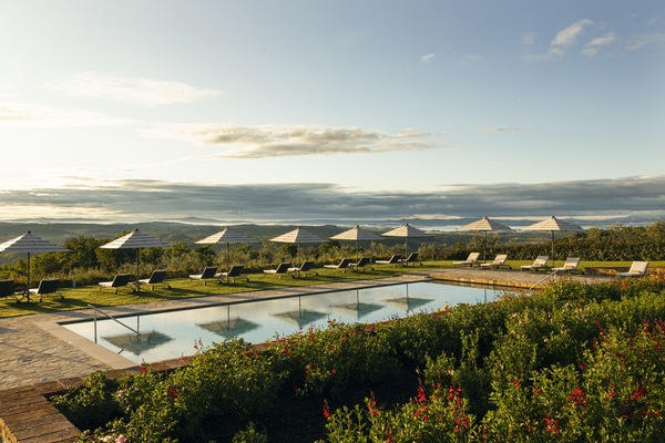 Seasonal outdoor pool, open 8:00 AM to 8:00 PM, pool umbrellas