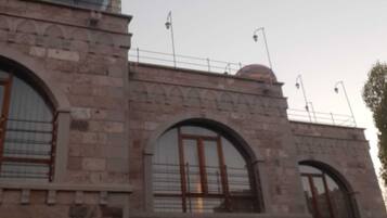 A historic building with arched windows and stone walls.