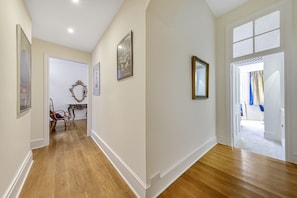 Enter a spacious room with a large window offering a view of the surrounding area.