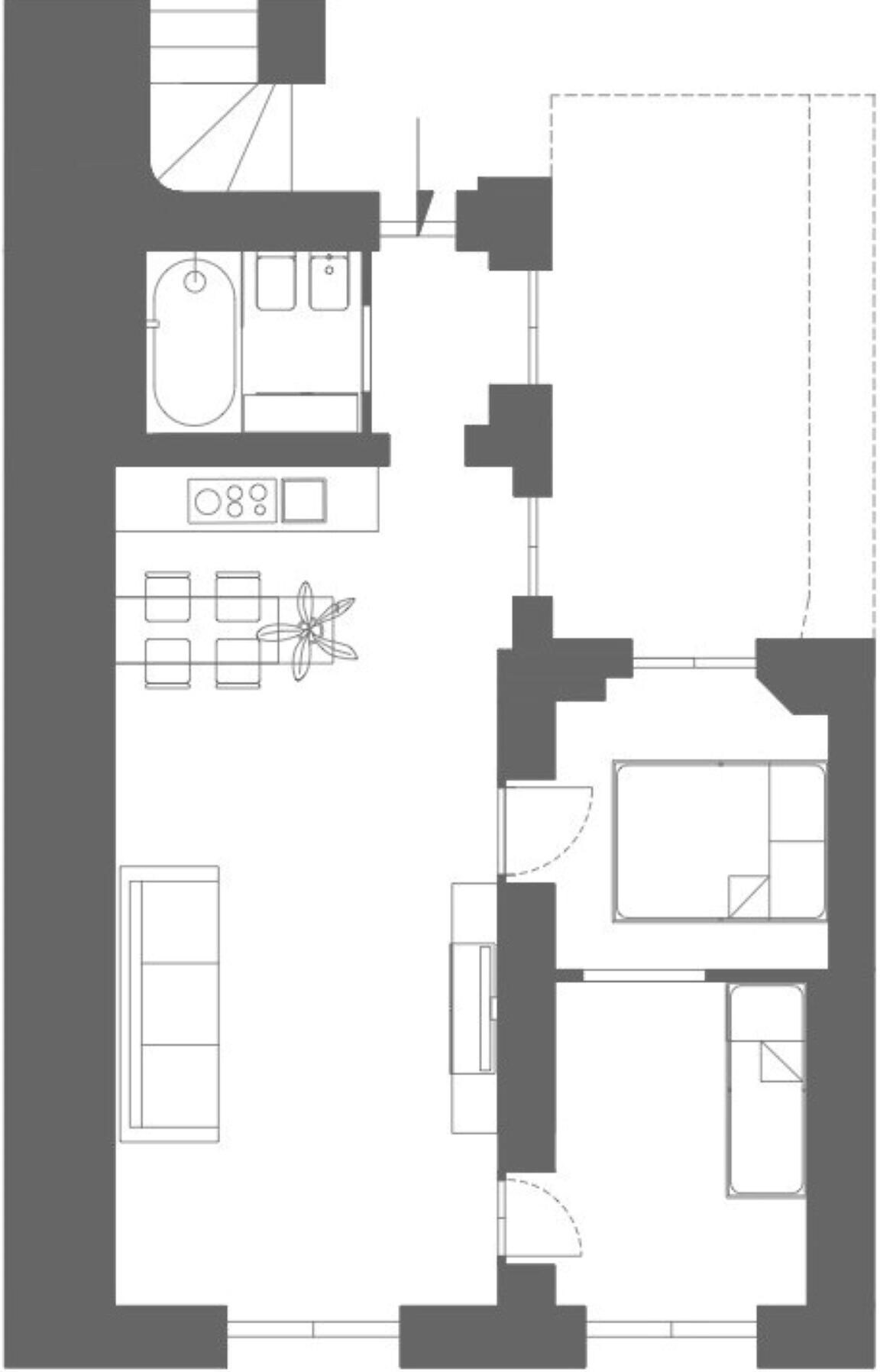 A floor plan with a kitchen, dining area, and a bathroom.