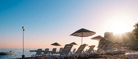Private beach, free beach shuttle, free beach cabanas, sun-loungers
