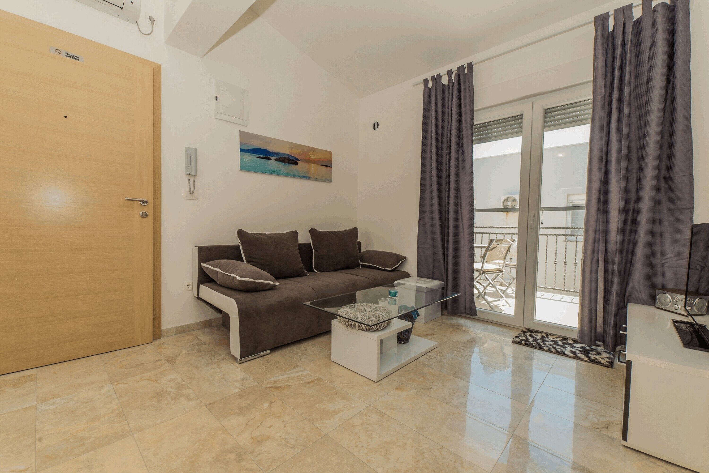 Comfort Apartment (A2) | Living area | 100-cm flat-screen TV with satellite channels, TV
