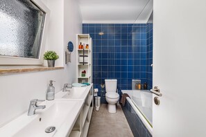 Combined shower/bathtub, hair dryer