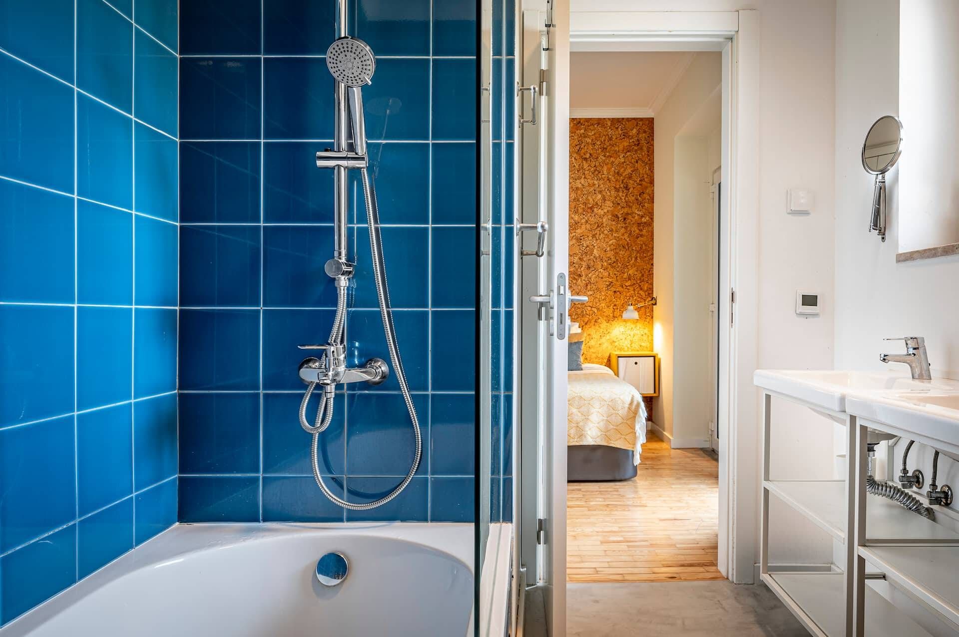 A modern bathroom with a shower, a bathtub, and a vanity with a mirror.